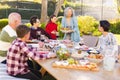 Happy caucasian family spending time together and having meal in the garden Royalty Free Stock Photo