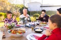 Happy caucasian family spending time together and praying before meal in the garden Royalty Free Stock Photo