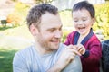 Happy Caucasian Father Having Fun with His Mixed Race Baby Son Royalty Free Stock Photo