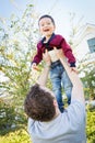 Happy Caucasian Father Having Fun with His Mixed Race Baby Son