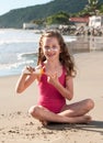 Happy Caucasian girl using sunblock on his face. Royalty Free Stock Photo