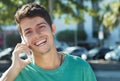 Happy caucasian guy at cellphone in the city Royalty Free Stock Photo