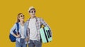 Happy Caucasian man and woman in sunglasses before going on summer vacation with tourist suitcase Royalty Free Stock Photo