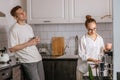 Happy caucasian married couple in the kitchen