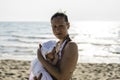 Happy caucasian mother with acne stained skin holding her infant baby girl on the beach in sunny day - Family, skincare, real