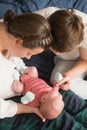 Happy parents holding their newborn baby girl Royalty Free Stock Photo