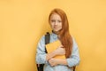 Happy caucasian school girl with a book