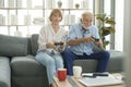 Happy Caucasian senior couple playing games at home Royalty Free Stock Photo