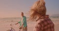 Happy caucasian senior couple riding bicycles together at the beach Royalty Free Stock Photo