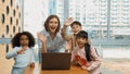 Caucasian teacher and multiethnic children waving hands to camera. Erudition.