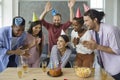 Happy Caucasian woman celebrating her birthday with her best multiracial friends. Royalty Free Stock Photo