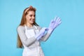 happy young caucasian woman wearing rubber gloves Royalty Free Stock Photo