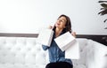 Happy caucasian young woman with paper white bags Royalty Free Stock Photo