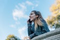 Happy Caucasian young woman talking in a park with her mobile phone Royalty Free Stock Photo