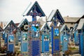 Happy cemetery with colored crosses