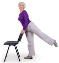 Happy charming beautiful elderly woman doing exercises at home on a chair. Workout gymnastics for health. On a white background Royalty Free Stock Photo