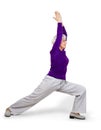 Happy charming beautiful elderly woman doing exercises while working out playing sports