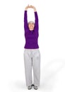 Happy charming beautiful elderly woman doing exercises while working out playing sports Royalty Free Stock Photo