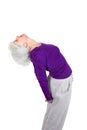 Happy charming beautiful elderly woman doing exercises while working out playing sports Royalty Free Stock Photo