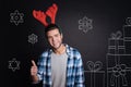 Happy charming man wearing Christmas accessory. Royalty Free Stock Photo