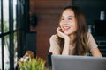 woman working outside and smiling in coffee shop freelancer thinking about new Royalty Free Stock Photo
