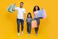 Happy Cheerful Arab Parents And Their Daughter Walking With Bright Shopping Bags Royalty Free Stock Photo