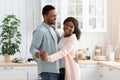 Happy Cheerful Black Spouses Having Romantic Moments At Home, Dancing In Kitchen Royalty Free Stock Photo