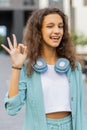 Happy cheerful child girl showing ok gesture, positive like sign, approve something good, celebrate Royalty Free Stock Photo