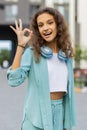 Happy cheerful child girl showing ok gesture, positive like sign, approve something good, celebrate Royalty Free Stock Photo