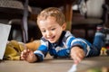 Happy cheerful child playing at home