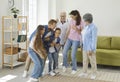 Happy, cheerful children, parents and grandparents playing and having fun together Royalty Free Stock Photo