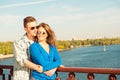 Happy cheerful couple in love embracing each other on the bridge Royalty Free Stock Photo