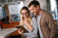 Happy cheerful couple in love using digital tablet together. Online shopping social media concept. Royalty Free Stock Photo