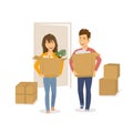 Happy cheerful couple man and woman moving in together in a new house