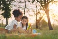 Happy cheerful ethnic girls play wooden block puzzle together at outdoors park , Relationship little kids, Diverse ethnic concept Royalty Free Stock Photo