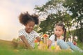 Happy cheerful ethnic girls play wooden block puzzle together at outdoors park , Relationship little kids, Diverse ethnic concept Royalty Free Stock Photo