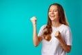 Happy cheerful excited young woman celebrating her success Royalty Free Stock Photo