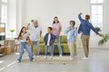 Happy, cheerful, funny family dancing in the living room of their house or apartment Royalty Free Stock Photo