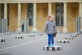 Happy cheerful girl running in Palais Royale in Paris Royalty Free Stock Photo