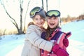 Happy and cheerful girls spend the air on a winter day