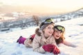 Happy and cheerful girls spend time outside on a winter day