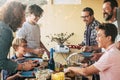 Happy cheerful group of caucasian people mixed generation and ages have fun together having dinner or lunch together - concept of Royalty Free Stock Photo