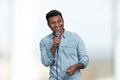 Happy cheerful man entertainer talking into microphone making speech or stand up show. Royalty Free Stock Photo