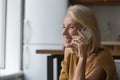 Happy cheerful middle aged senior woman making telephone call Royalty Free Stock Photo