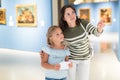 Mother and daughter looking at expositions in museum Royalty Free Stock Photo