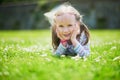 Happy cheerful preschool girl walking in park