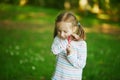 Happy cheerful preschool girl walking in park