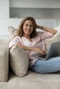 Happy cheerful pretty laptop user woman home vertical portrait Royalty Free Stock Photo