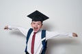 Happy cheerful schoolboy in graduate hat. Passed the exams. Junior High School