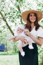 Happy cheerful smiling people caucasian ethnicity. Beautiful cute mother holding her baby. Pretty family. Royalty Free Stock Photo